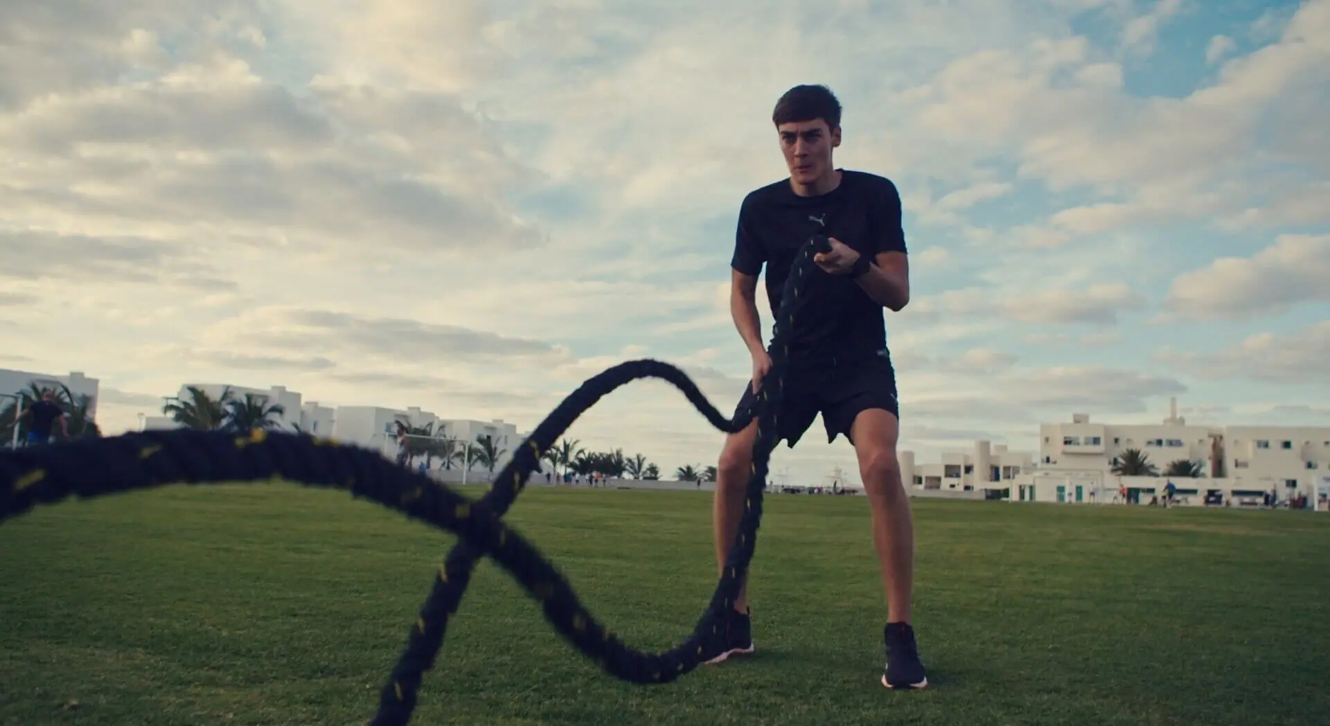 Screenshot from the Sky F1 TV series ' Next Generation' showcasing formula 1 driver, George Russel, exercising using battle ropes.